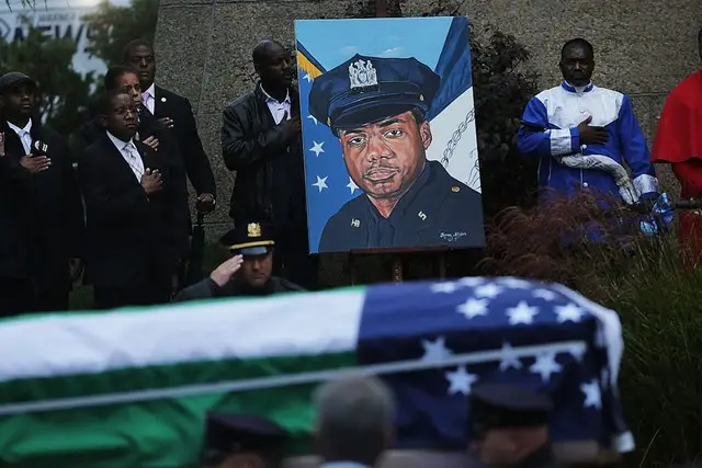 The funeral for officer Randolph Holder was attended by the mayor, the police commissioner, and thousands of police officers.
